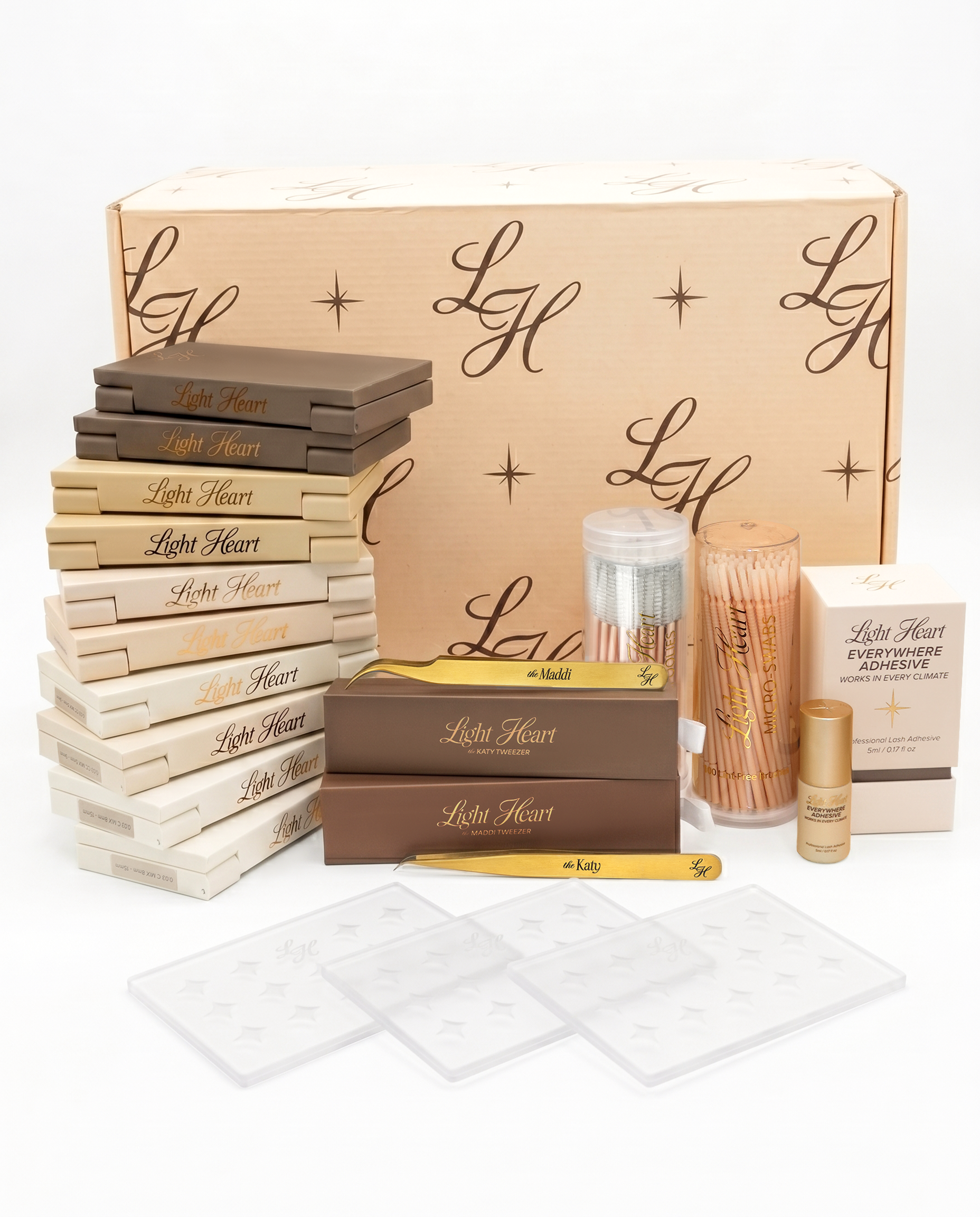 Light Heart Lashes professional kit with lash trays, tweezers, adhesive, and branded box