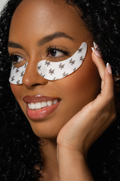 Model wearing under-eye gel patches designed to protect the skin during eyelash extension application and lash beauty treatments