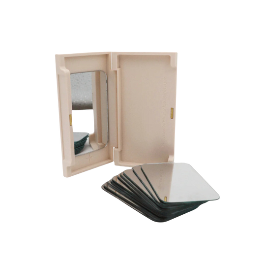 Light Heart Lashes empty lash tray case with built-in mirror, shown beside stack of mirrored insert cards